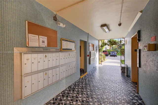 a view of hallway with chandelier