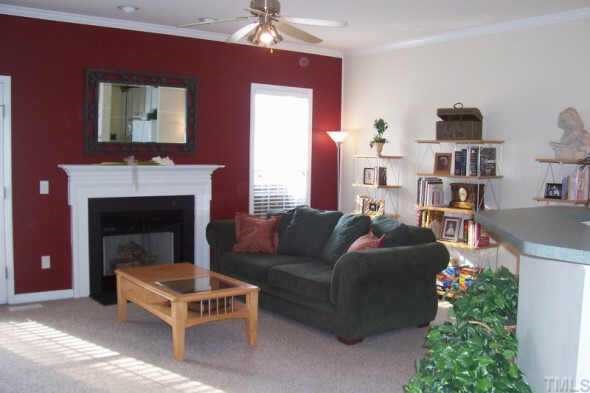2914 Sap Lane Raleigh, NC 27603 - Photo 3 of 10 Bright family room with fireplace.
