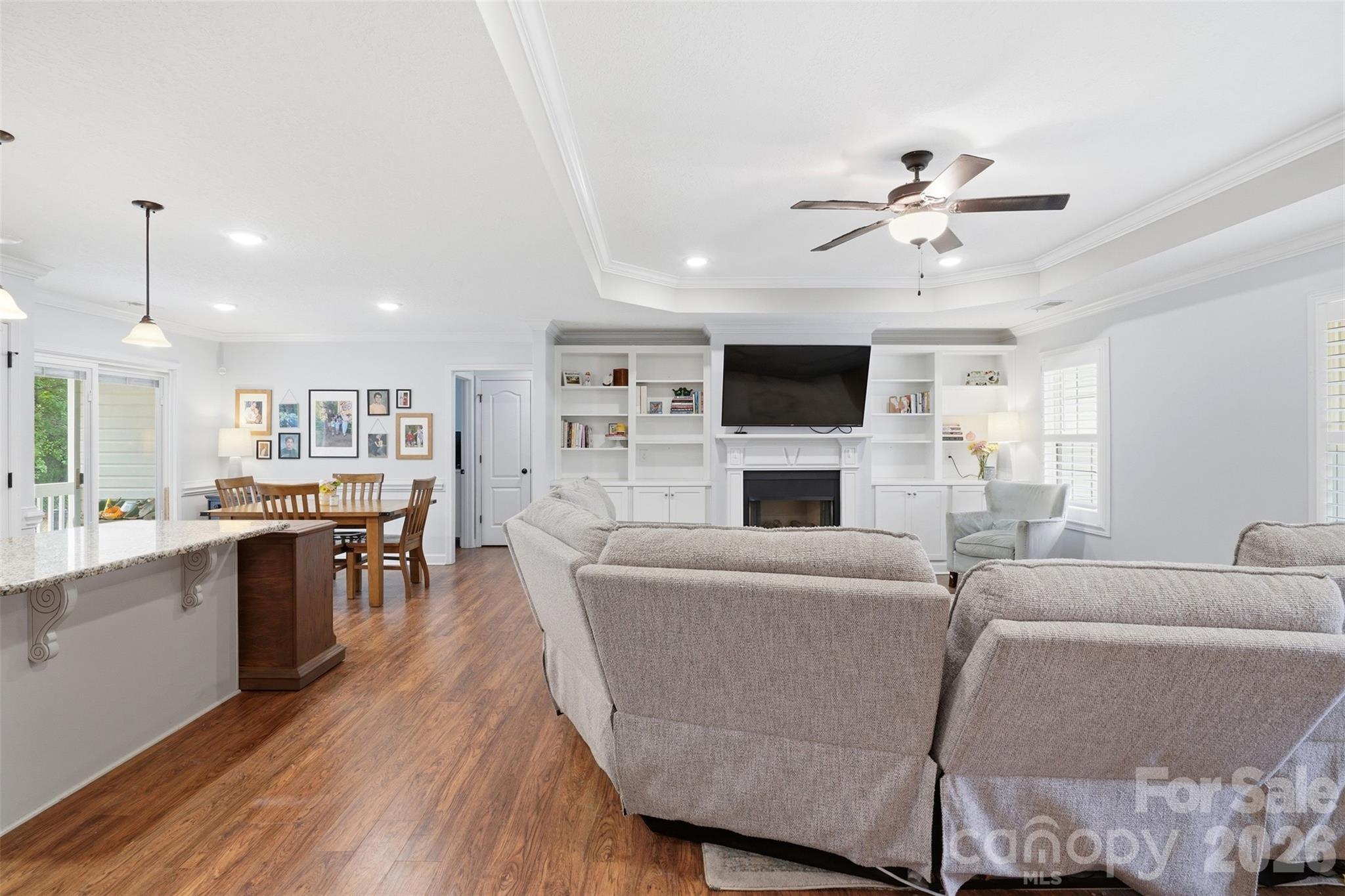 810 Tirzah Road York, SC 29745 - Photo 12 of 29 a living room with furniture a fireplace a flat screen tv and kitchen view