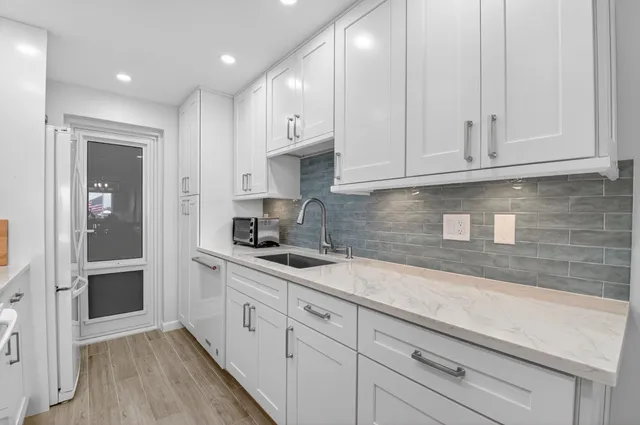 a bedroom with a bed and a lamp