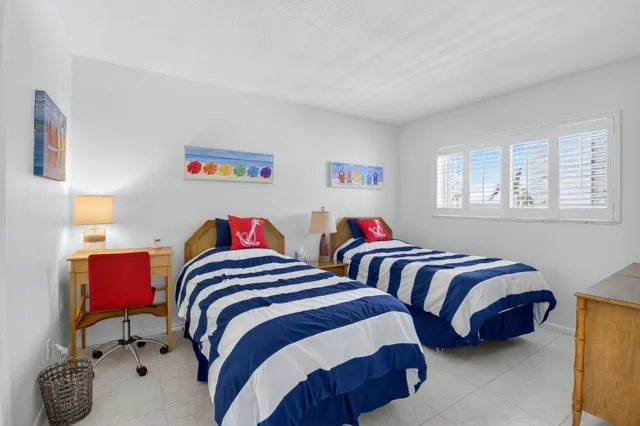 a view of a chairs and table in the balcony