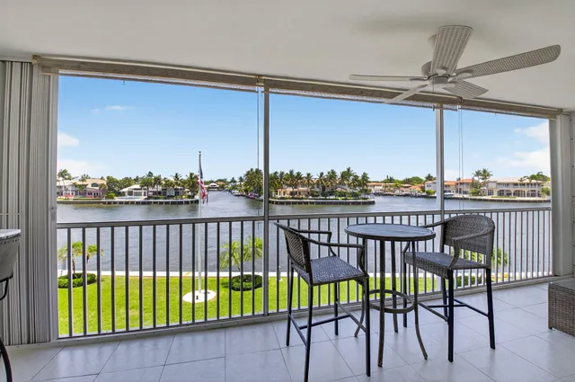 a living room with a sink and a large mirror