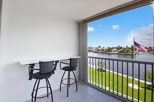 a view of a swimming pool with outdoor seating