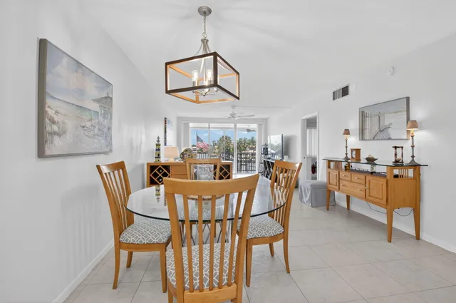a living room with furniture large window and flat screen tv