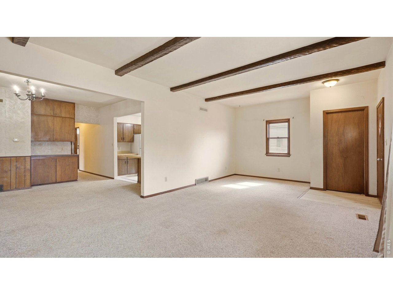 914 Prospect Street Fort Morgan, CO 80701 - Photo 4 of 17 a open hall with a hardwood floor and a bathroom