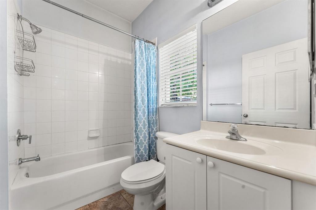 3307 Merrick Lane, Unit 1004 Margate, FL 33063 - Photo 11 of 30 a bathroom with a sink toilet and shower
