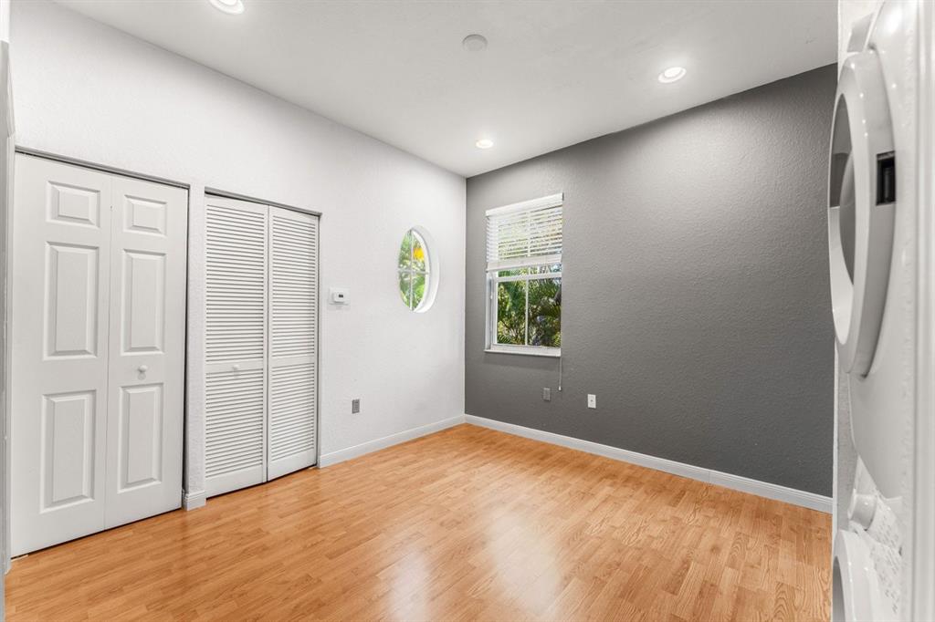 3307 Merrick Lane, Unit 1004 Margate, FL 33063 - Photo 12 of 30 an empty room with windows and closet