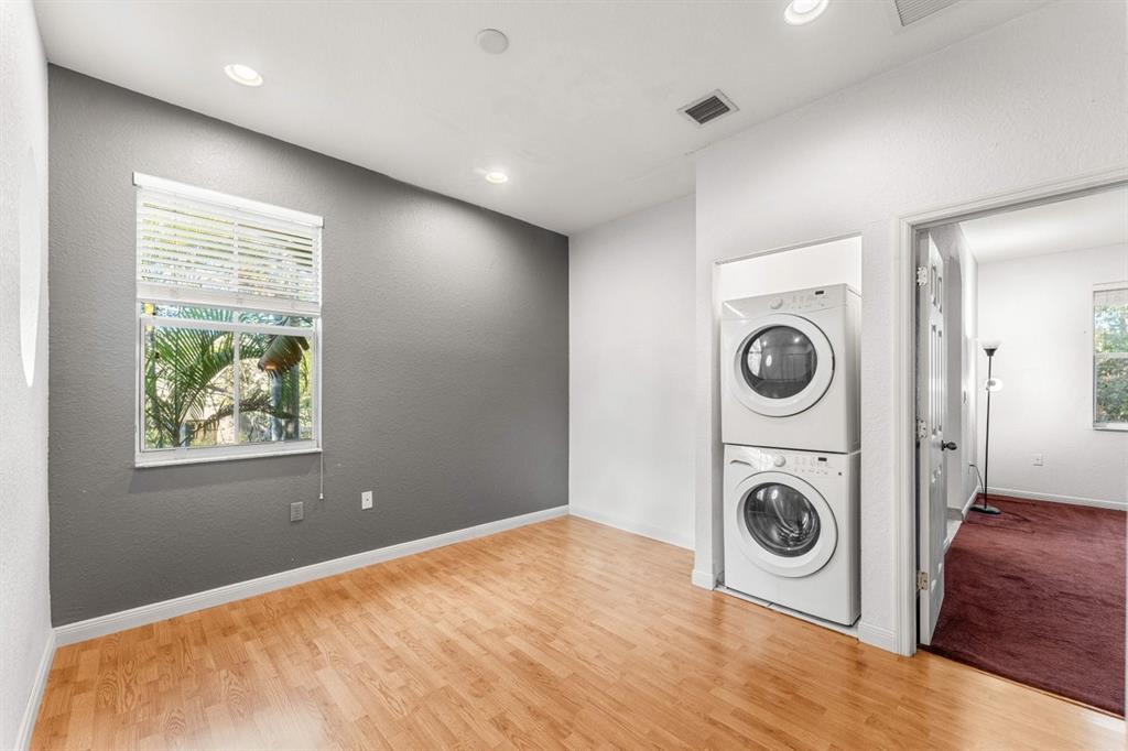 3307 Merrick Lane, Unit 1004 Margate, FL 33063 - Photo 14 of 30 a view of a storage & utility room with washer and dryer