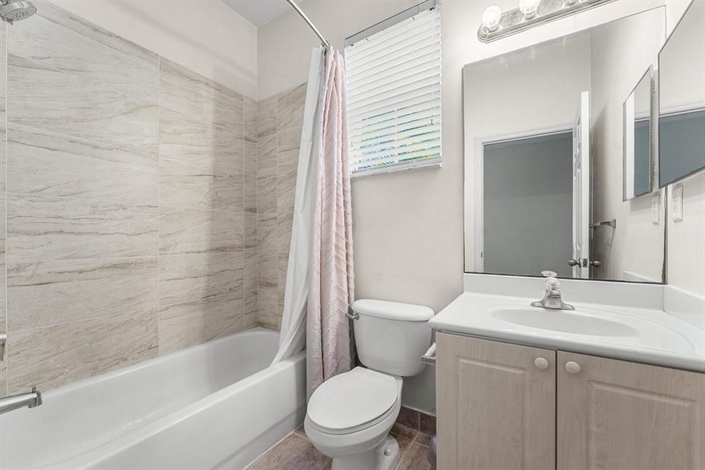 3307 Merrick Lane, Unit 1004 Margate, FL 33063 - Photo 17 of 30 a bathroom with a sink toilet and shower