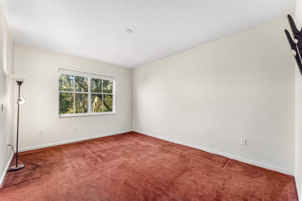 3307 Merrick Lane, Unit 1004 Margate, FL 33063 - Photo 18 of 30 an empty room with windows