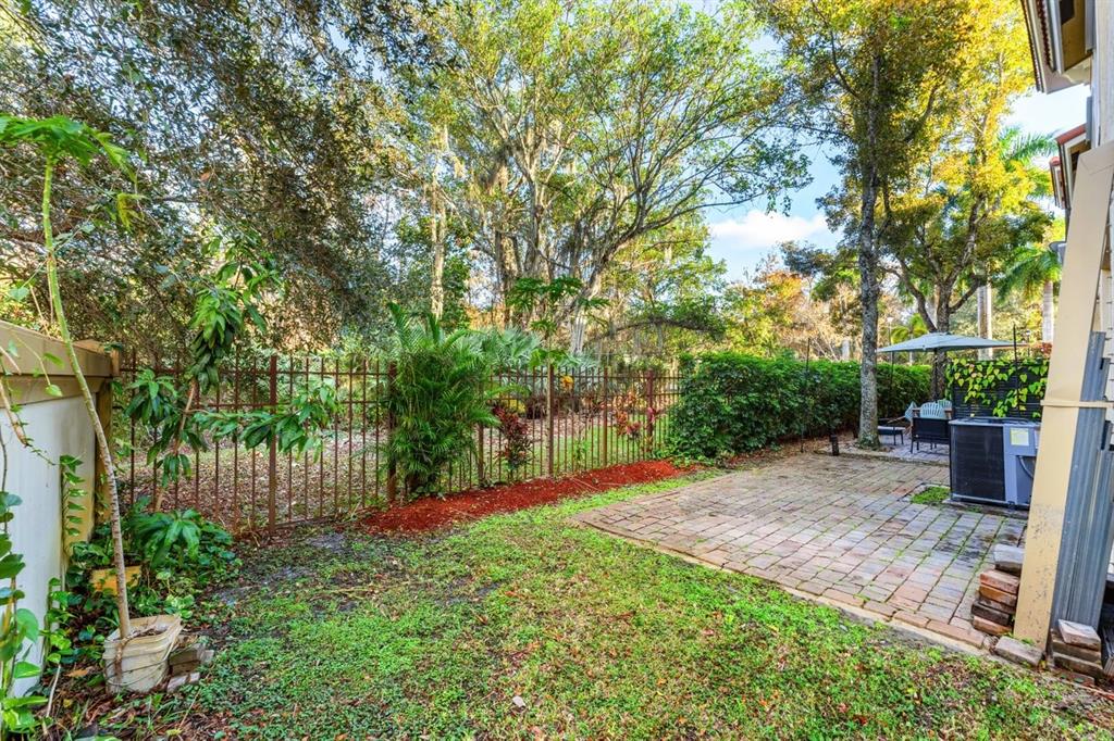 3307 Merrick Lane, Unit 1004 Margate, FL 33063 - Photo 26 of 30 a view of a backyard with a tree