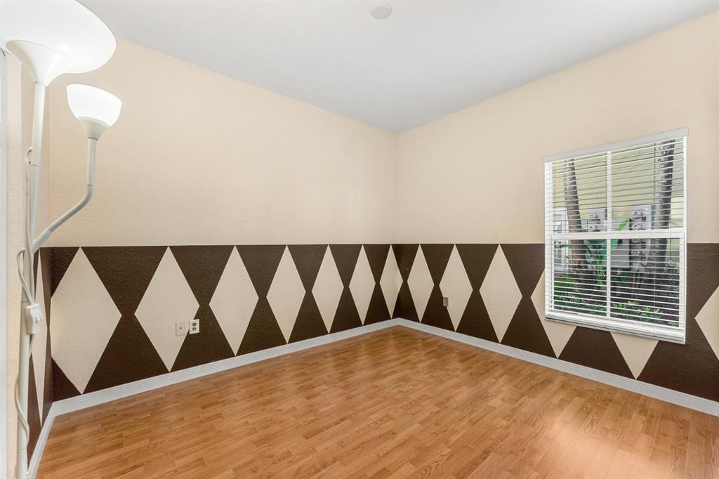 3307 Merrick Lane, Unit 1004 Margate, FL 33063 - Photo 9 of 30 a view of wooden floor and a black umbrella