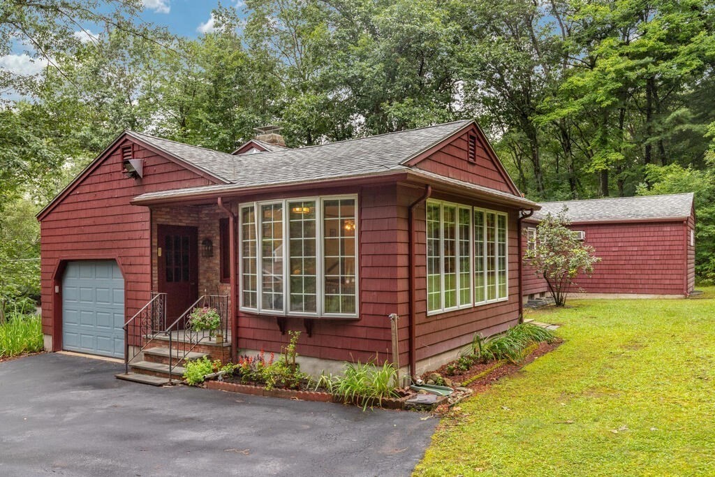 10 Galloway Road Chelmsford, MA 01824 - Photo 31 of 37 a front view of a house with a garden
