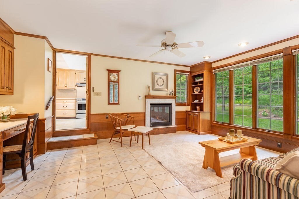 10 Galloway Road Chelmsford, MA 01824 - Photo 6 of 37 a living room with furniture fireplace and large windows