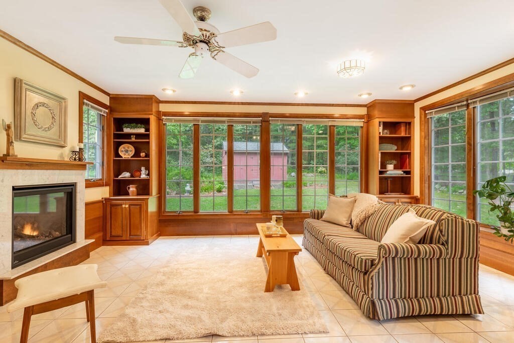 10 Galloway Road Chelmsford, MA 01824 - Photo 8 of 37 a balcony with furniture and a fireplace