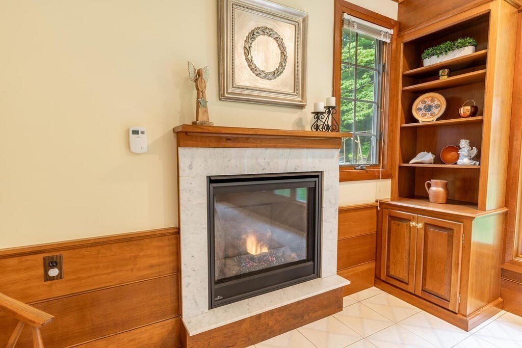 10 Galloway Road Chelmsford, MA 01824 - Photo 9 of 37 a view of fireplace with washer and dryer
