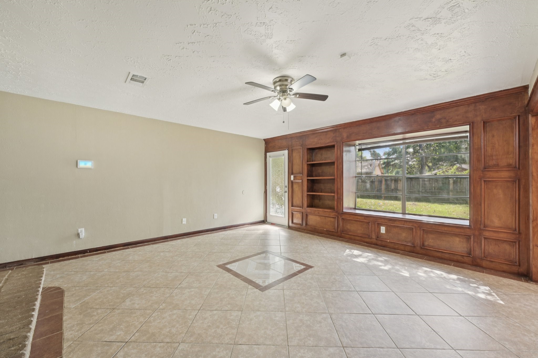 4310 Towergate Drive Spring, TX 77373 - Photo 11 of 46 an empty room with windows and chandelier fan