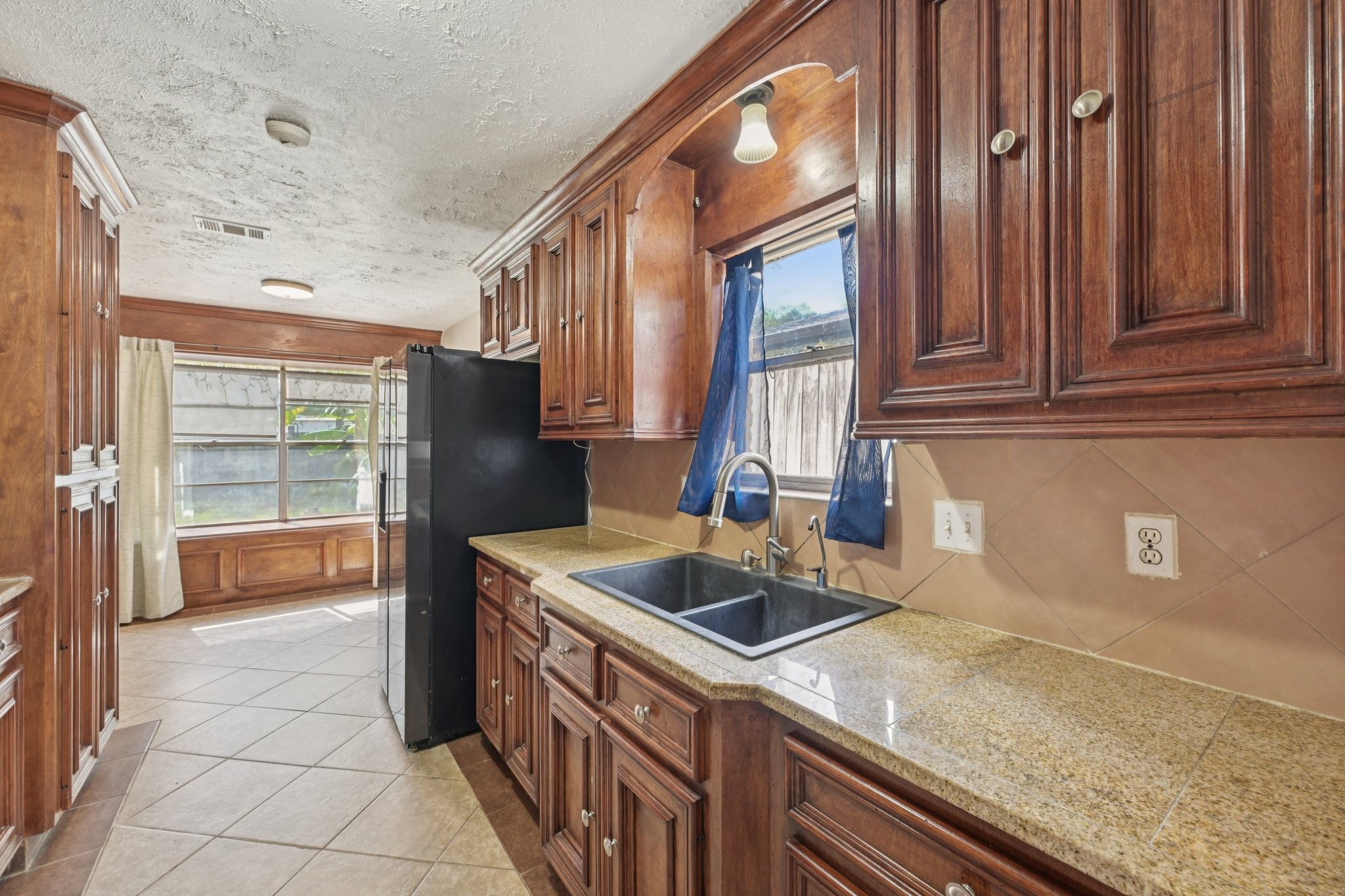 4310 Towergate Drive Spring, TX 77373 - Photo 15 of 46 a kitchen that has a sink and a stove in it