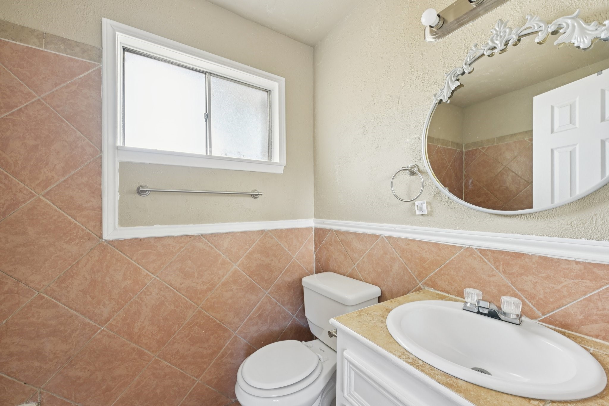 4310 Towergate Drive Spring, TX 77373 - Photo 22 of 46 a bathroom with a toilet sink and mirror