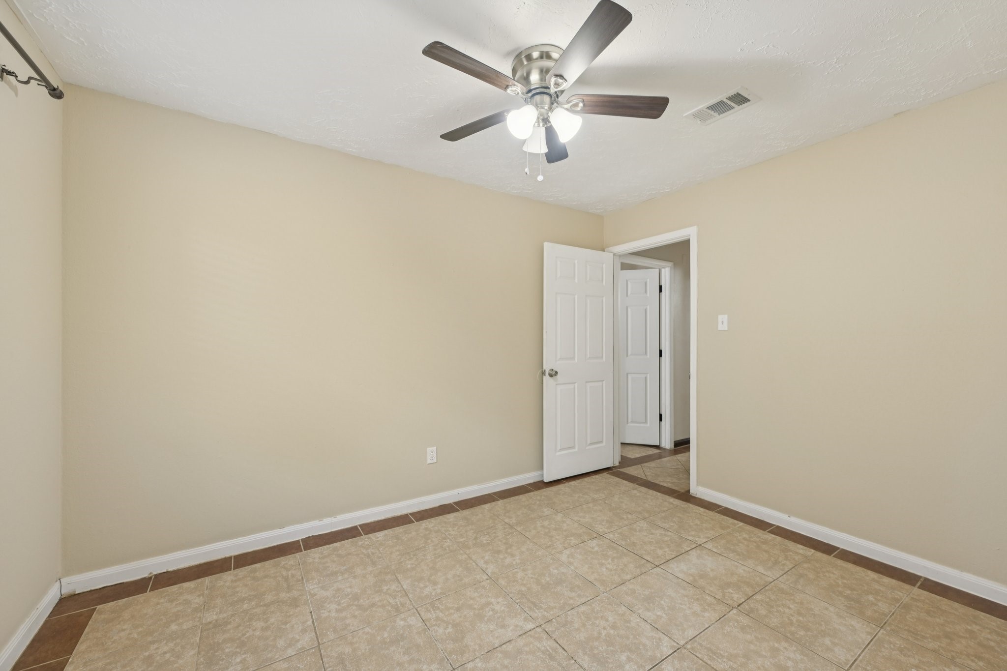 4310 Towergate Drive Spring, TX 77373 - Photo 24 of 46 an empty room with a ceiling fan and a window