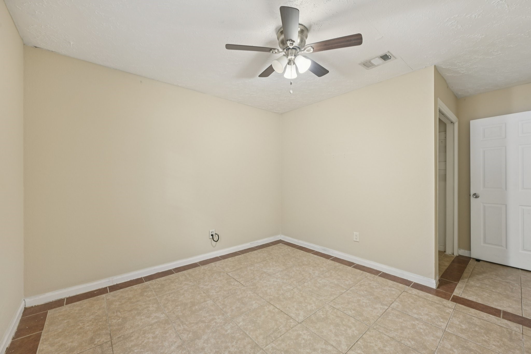 4310 Towergate Drive Spring, TX 77373 - Photo 26 of 46 an empty room with a chandelier fan