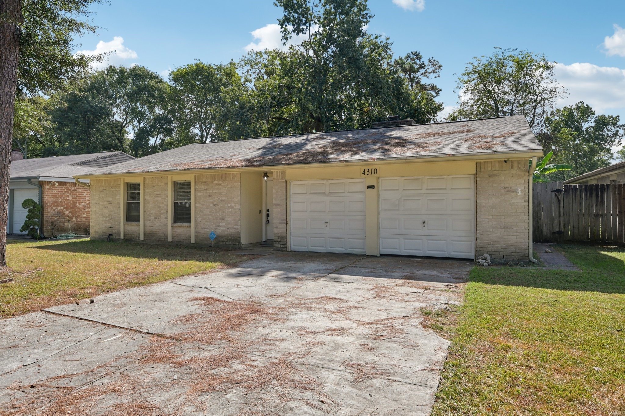 4310 Towergate Drive Spring, TX 77373 - Photo 3 of 46 a view of a white house with a yard and large tree