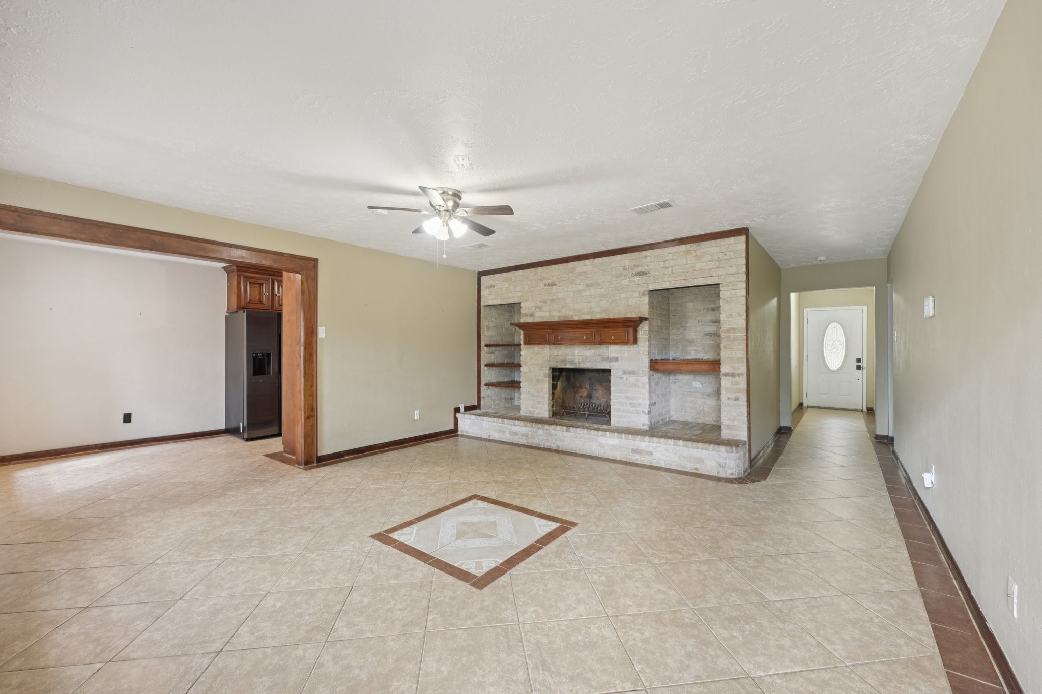 4310 Towergate Drive Spring, TX 77373 - Photo 6 of 46 an empty room with furniture and a fireplace