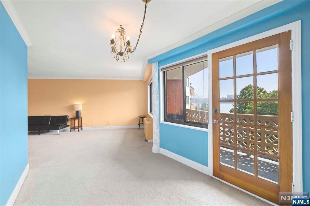 1375 River Road, Unit 4D Edgewater, NJ 07020 - Photo 15 of 25 a view of room with window and cabinet