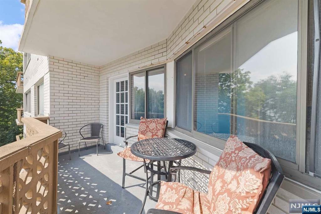 1375 River Road, Unit 4D Edgewater, NJ 07020 - Photo 22 of 25 a outdoor living space with furniture and a potted plant