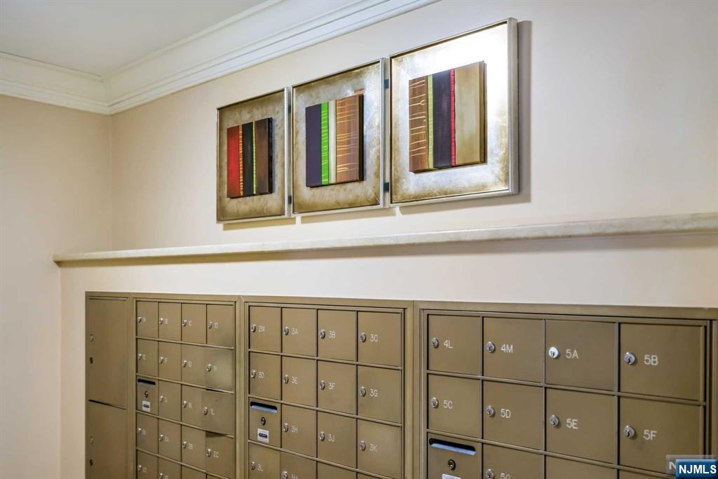 1375 River Road, Unit 4D Edgewater, NJ 07020 - Photo 23 of 25 a bathroom with a sink and a mirror