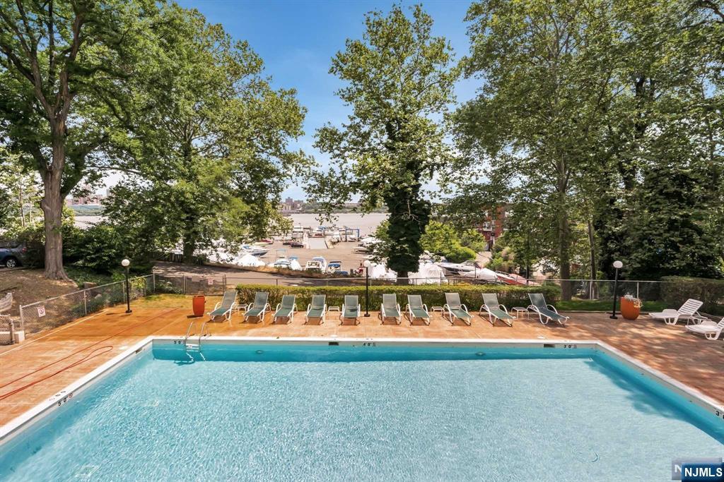 1375 River Road, Unit 4D Edgewater, NJ 07020 - Photo 25 of 25 a view of swimming pool with an outdoor seating