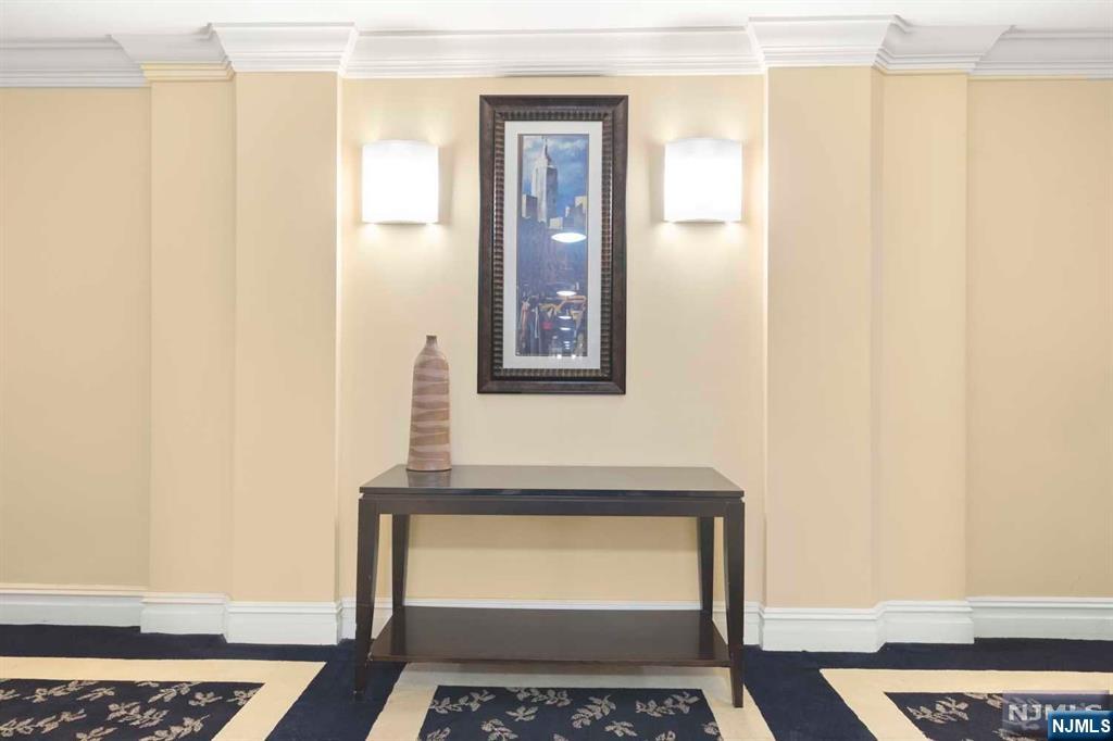 1375 River Road, Unit 4D Edgewater, NJ 07020 - Photo 3 of 25 a bathroom with a sink and a mirror