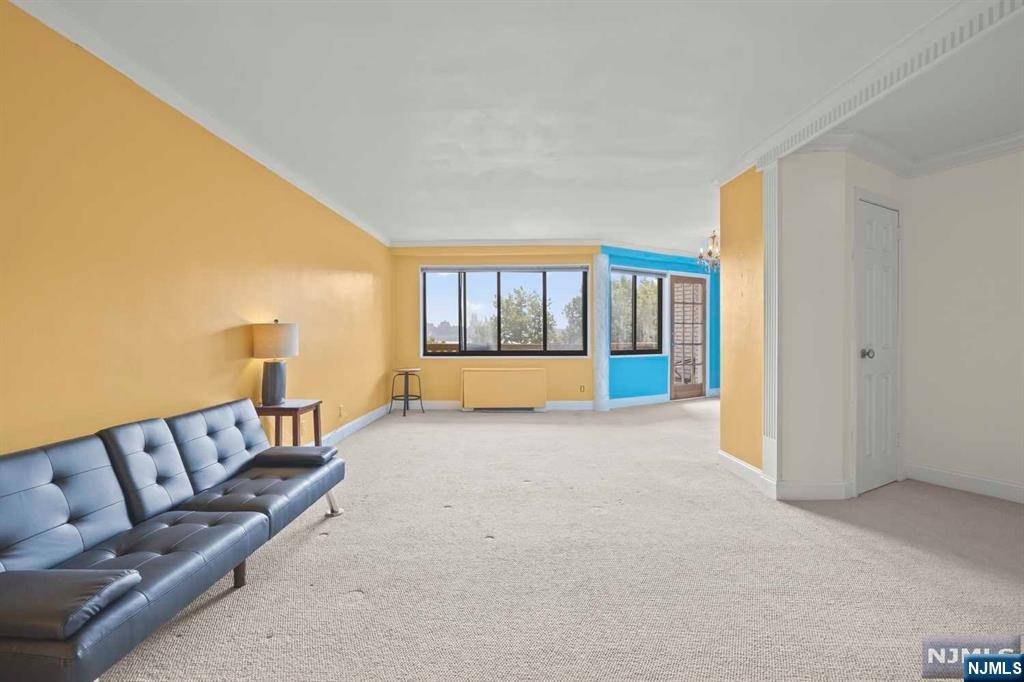 1375 River Road, Unit 4D Edgewater, NJ 07020 - Photo 6 of 25 a living room with a couch and a window