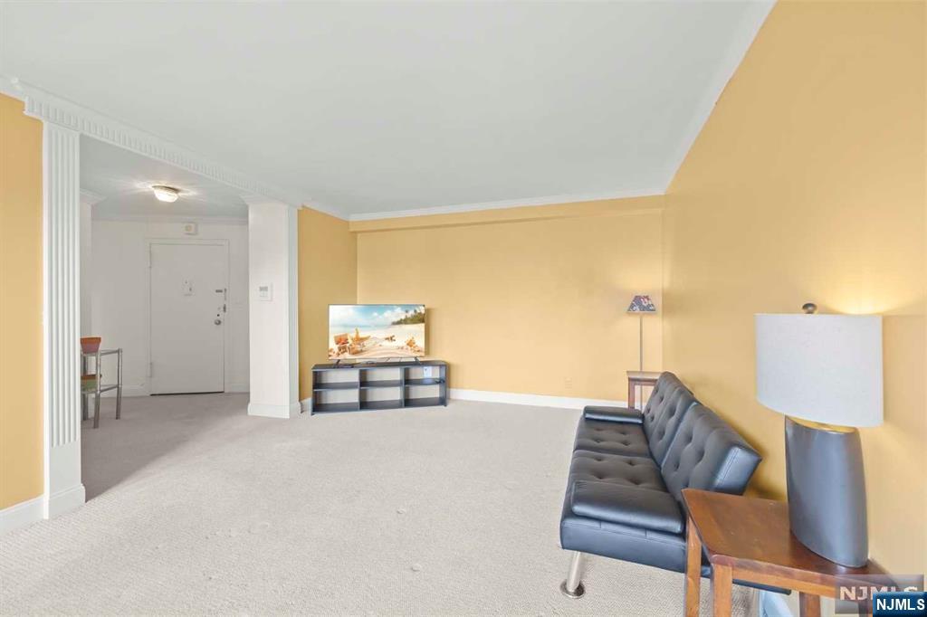 1375 River Road, Unit 4D Edgewater, NJ 07020 - Photo 10 of 25 a living room with furniture and wooden floor