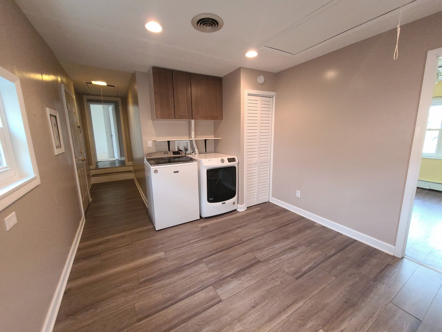 7807 Parkside Avenue Burbank, IL 60459 - Photo 16 of 23 a view of a kitchen with a sink and dishwasher a refrigerator with wooden floor