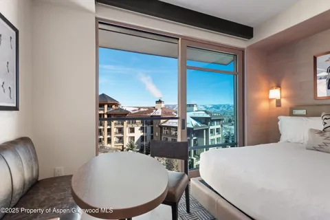 a kitchen with cabinets and window