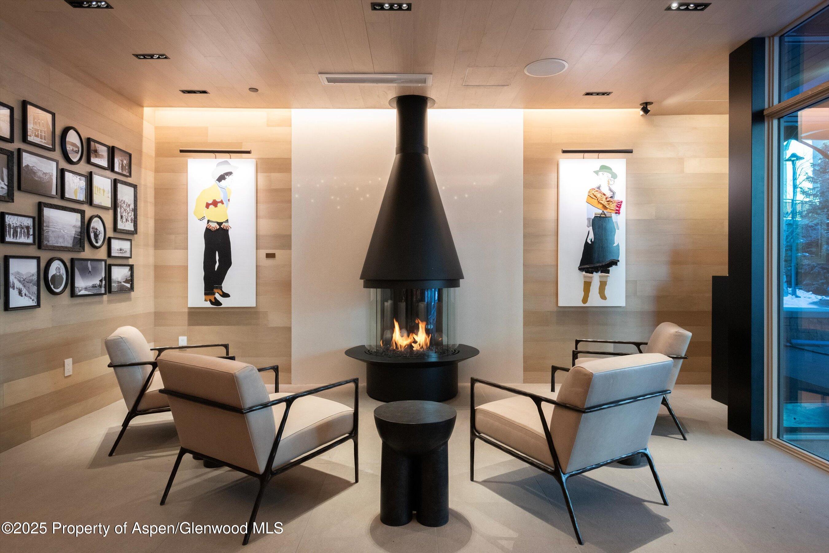 130 Wood Road, Unit 660662 Snowmass Village, CO 81615 - Photo 21 of 31 a living room with furniture and a flat screen tv