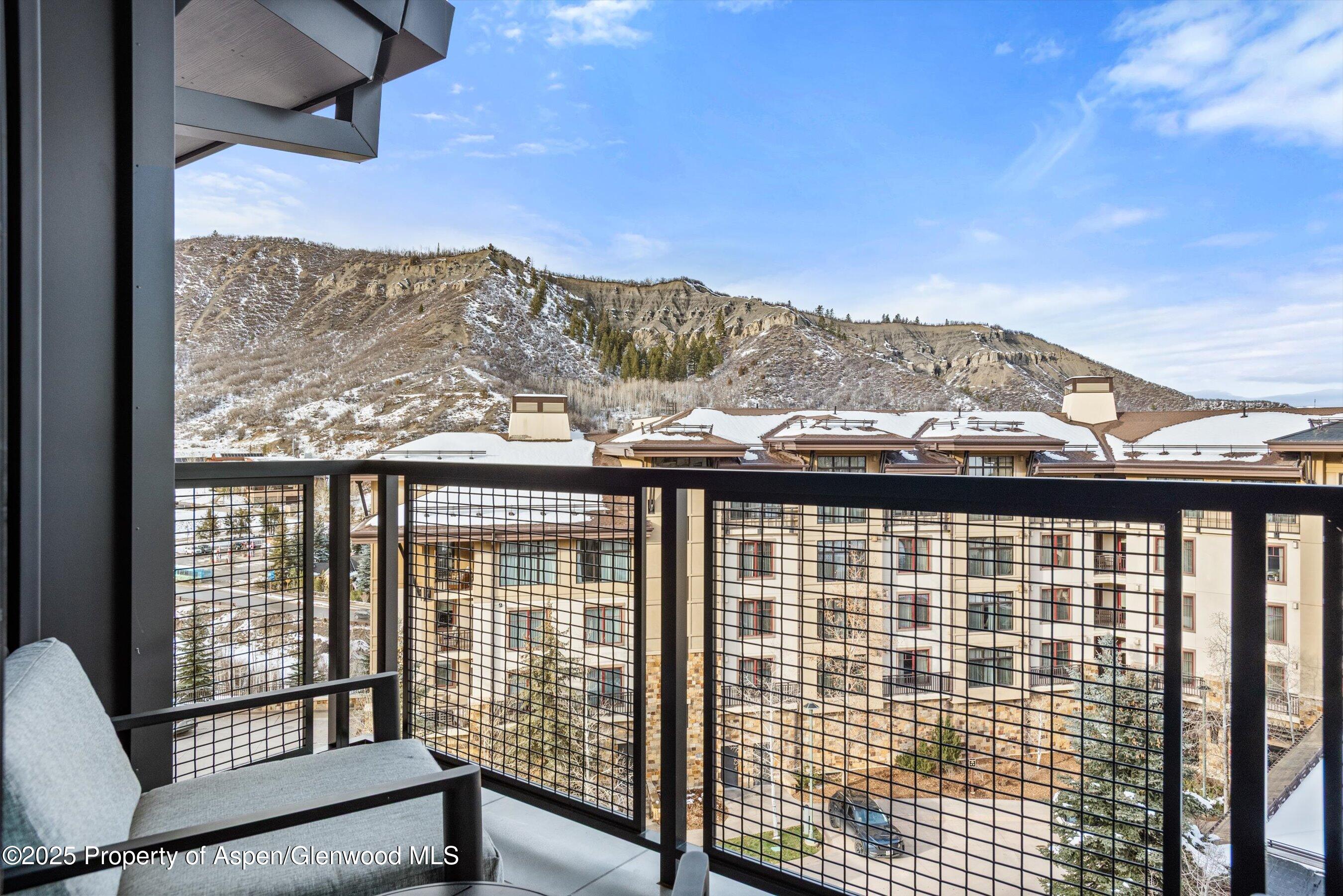 130 Wood Road, Unit 660662 Snowmass Village, CO 81615 - Photo 4 of 31 a view of a balcony with an ocean view