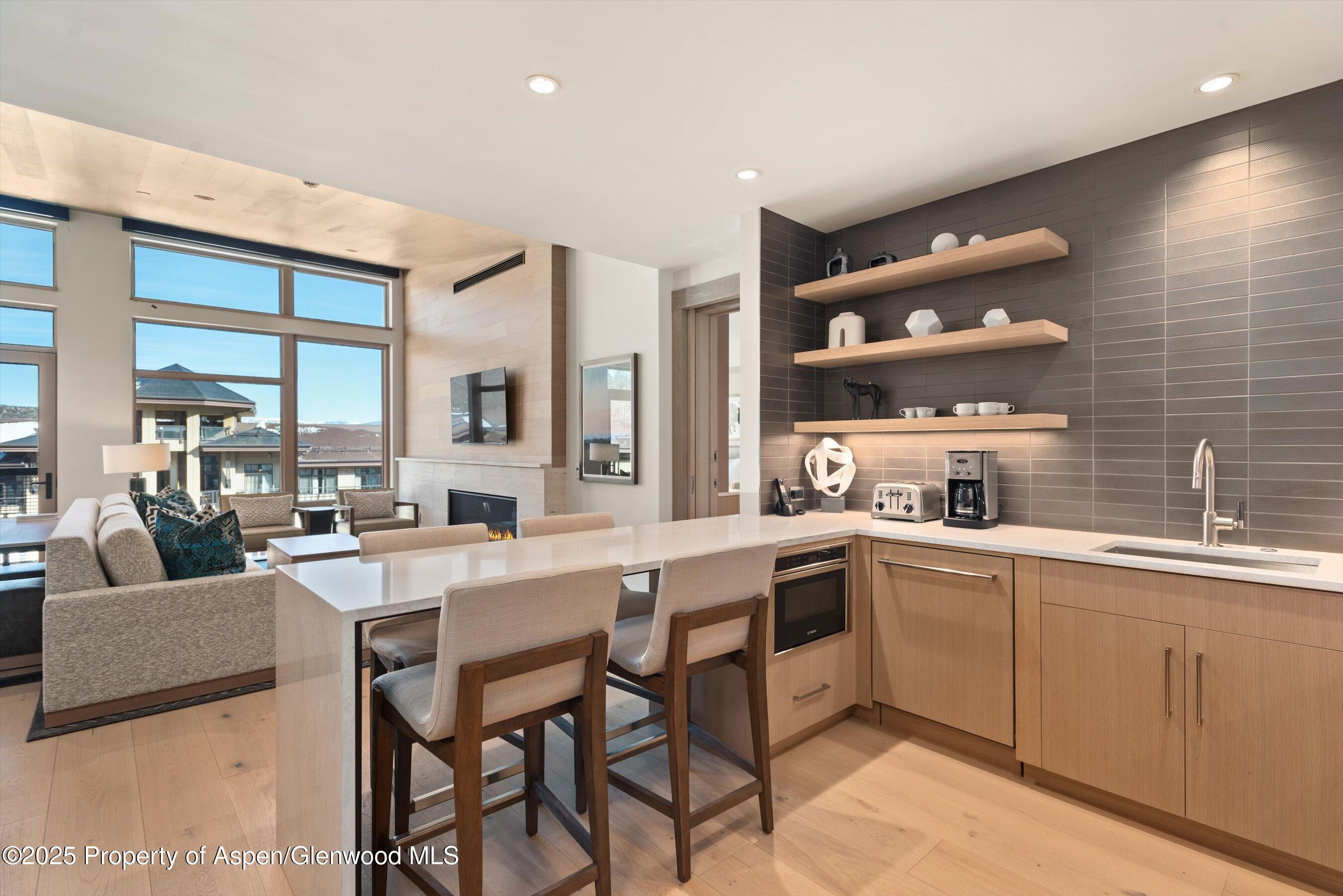 130 Wood Road, Unit 660662 Snowmass Village, CO 81615 - Photo 8 of 31 a kitchen with counter space cabinets and appliances