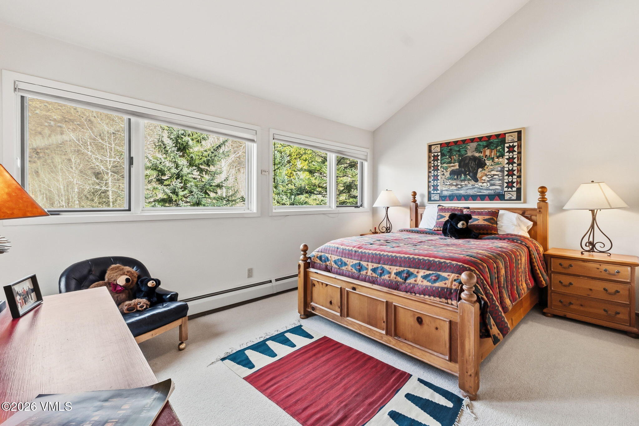 1460 Ridge Lane, Unit D Vail, CO 81657 - Photo 11 of 18 a bedroom with a bed a dresser next to a window