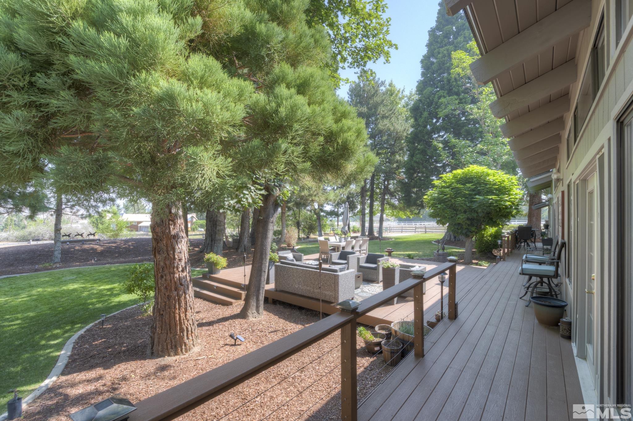 4185 Juniper Creek Road Reno, NV 89519 - Photo 25 of 40 swimming pool view with a seating space and a garden