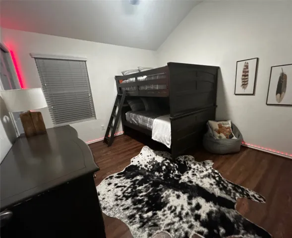 a living room with a couch and a potted plant