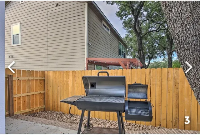 a wooden bench sitting in front of a building