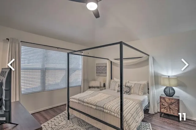 a bedroom with a bed and window