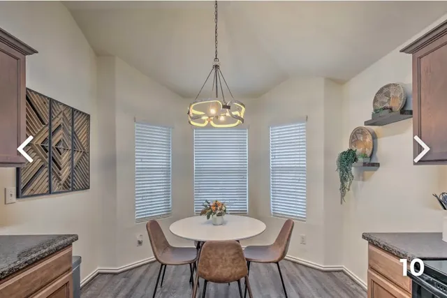 a dining room with furniture and window
