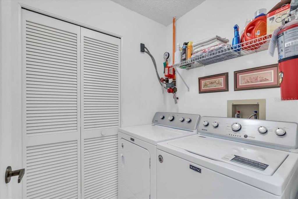 6807 Stone River Road, Unit 204 Bradenton, FL 34203 - Photo 11 of 54 a utility room with dryer and washer