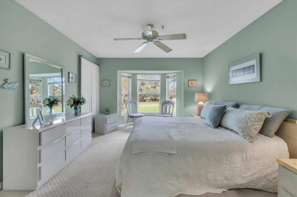 6807 Stone River Road, Unit 204 Bradenton, FL 34203 - Photo 23 of 54 a large bedroom with a large bed and a large window