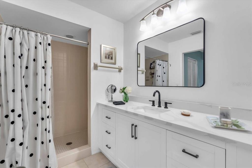 6807 Stone River Road, Unit 204 Bradenton, FL 34203 - Photo 27 of 54 a bathroom with a double vanity sink and a mirror