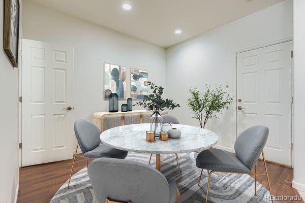 8320 Stonybridge Circle Littleton, CO 80126 - Photo 2 of 11 a dining room with furniture and wooden floor