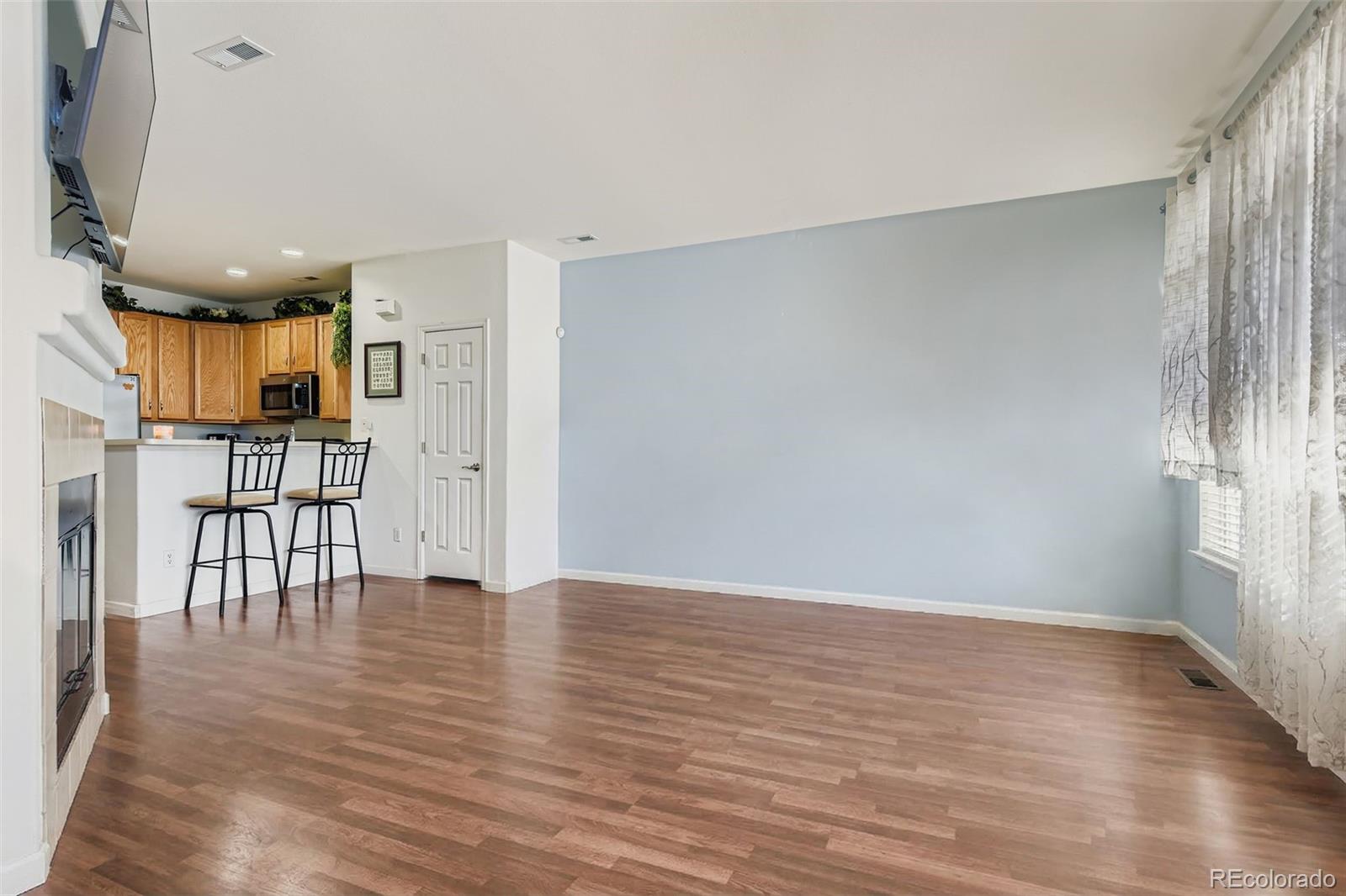 8320 Stonybridge Circle Littleton, CO 80126 - Photo 5 of 11 a view of kitchen with furniture and wooden floor